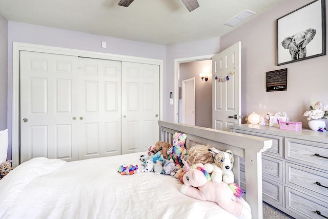 bedroom featuring carpet, ceiling fan, and a closet