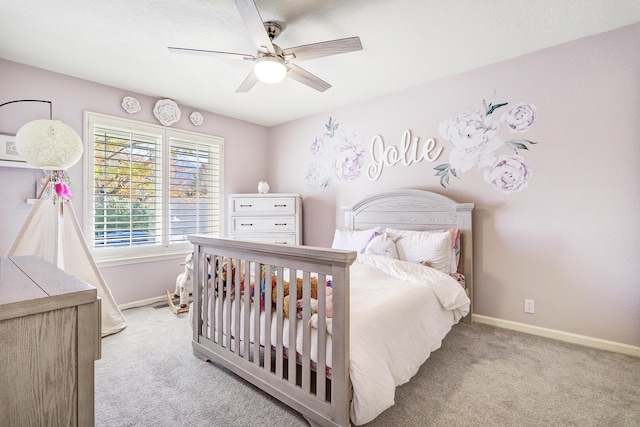 bedroom with ceiling fan and light colored carpet