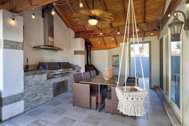 kitchen featuring wall chimney exhaust hood, beam ceiling, wooden ceiling, and high vaulted ceiling