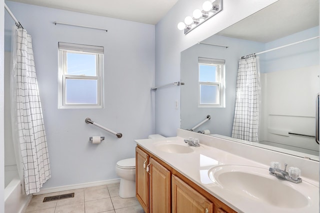 full bathroom with tile patterned flooring, vanity, shower / tub combo with curtain, and plenty of natural light