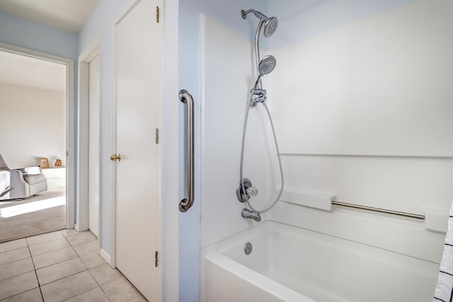 bathroom featuring tile patterned flooring and  shower combination