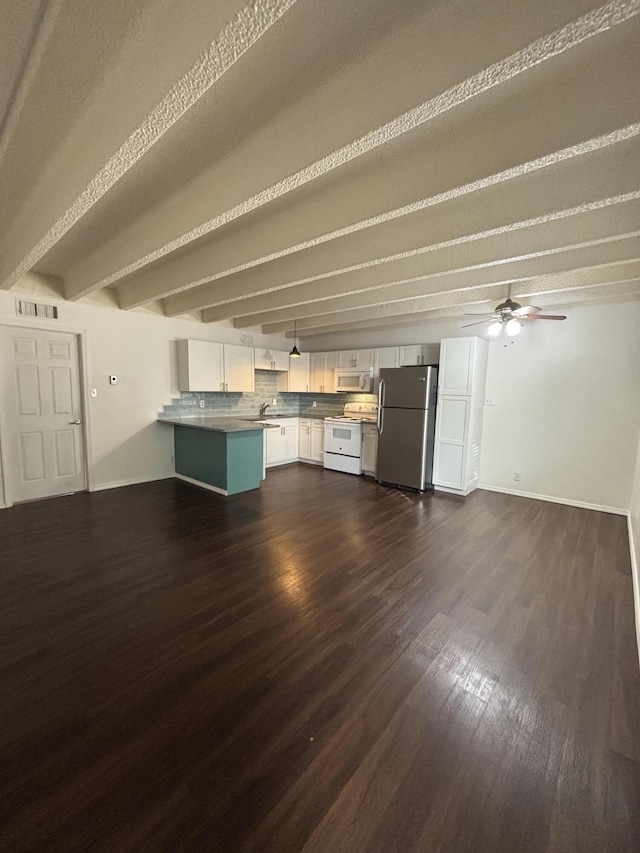 unfurnished living room featuring beamed ceiling, ceiling fan, and dark hardwood / wood-style flooring