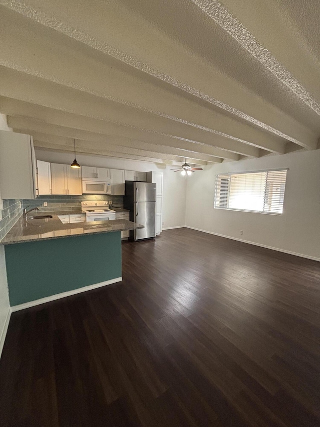 unfurnished living room with a textured ceiling, ceiling fan, sink, beamed ceiling, and dark hardwood / wood-style floors