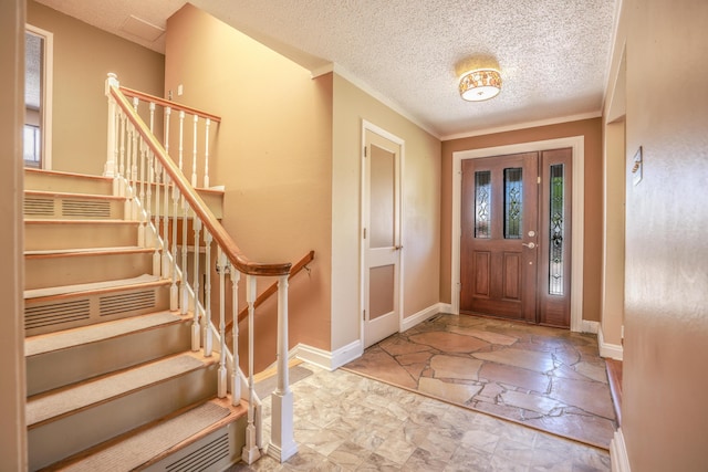 7908 Sierra Azul Ave NE, Albuquerque, NM 87110 - foyer featuring ornamental molding, baseboards, stone finish floors, stairway, and a textured ceiling