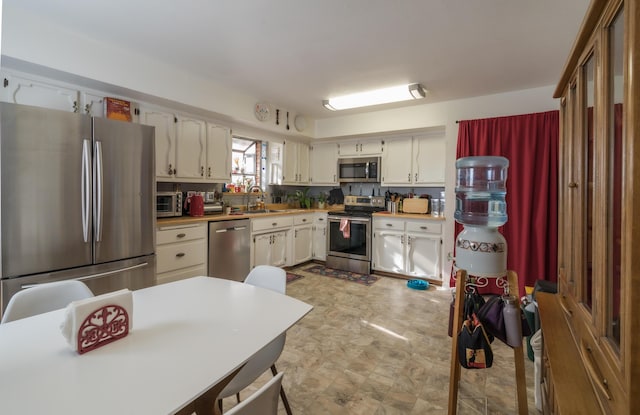 kitchen with sink and appliances with stainless steel finishes