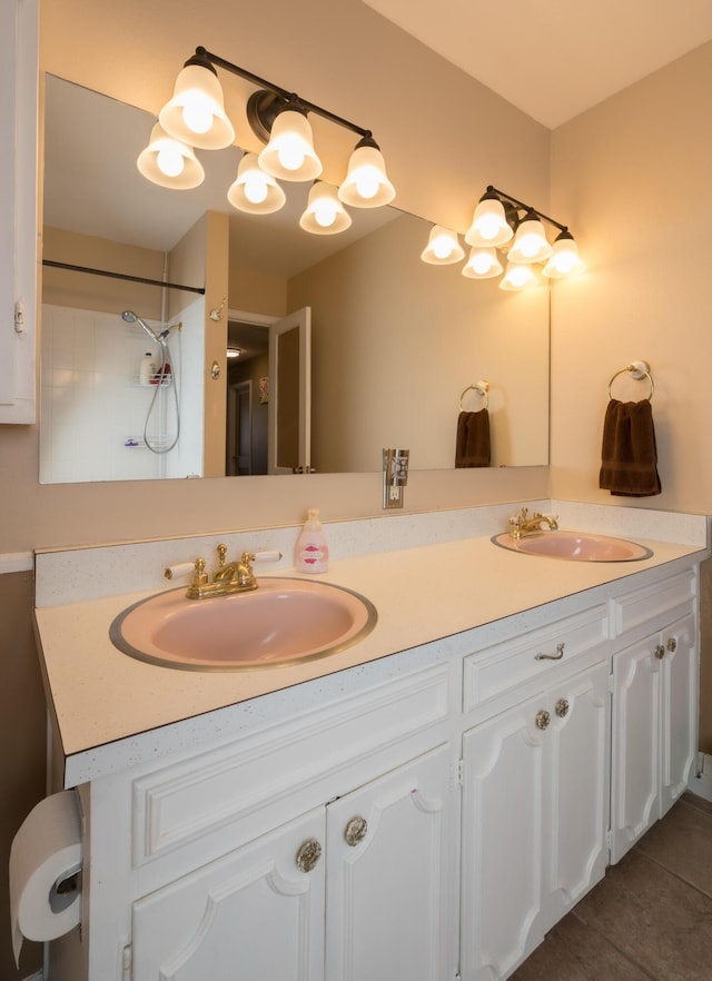 bathroom with tile patterned flooring and vanity