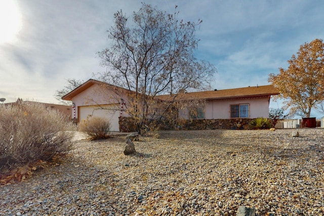 ranch-style home featuring a garage