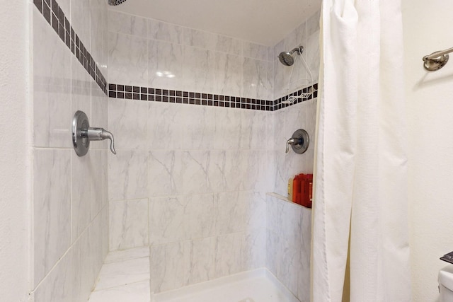 bathroom with a shower with shower curtain