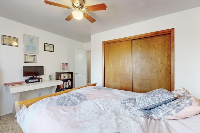 bedroom featuring a closet, ceiling fan, and carpet flooring