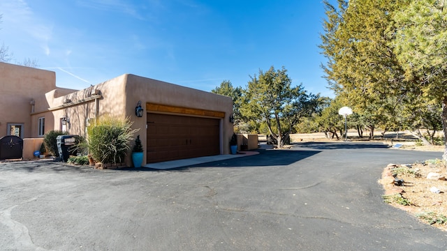 2 Chaco Ct, Sandia Park, NM 87047 - view of home's exterior with a garage