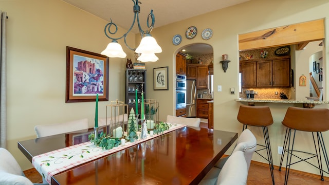 dining area featuring a notable chandelier