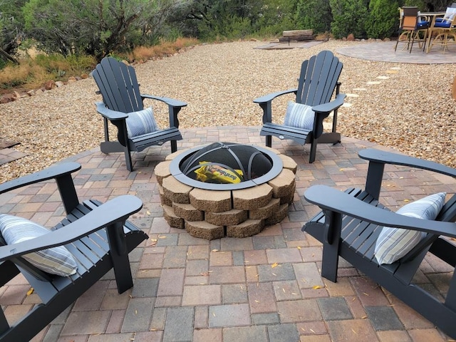 2 Chaco Ct, Sandia Park, NM 87047 - view of patio / terrace featuring a fire pit