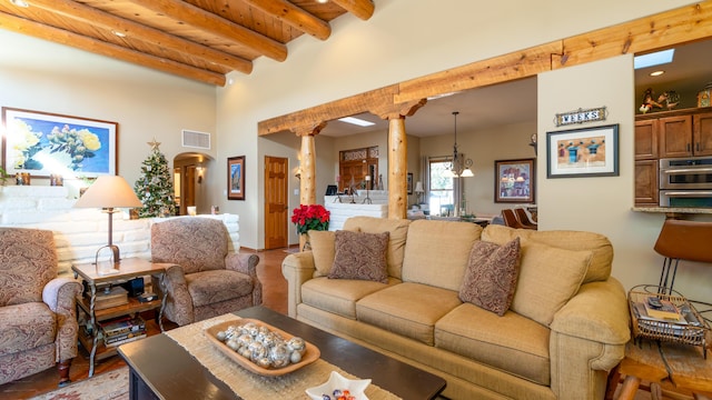 2 Chaco Ct, Sandia Park, NM 87047 - living room featuring ornate columns, beam ceiling, recessed lighting, arched walkways, and wood finished floors