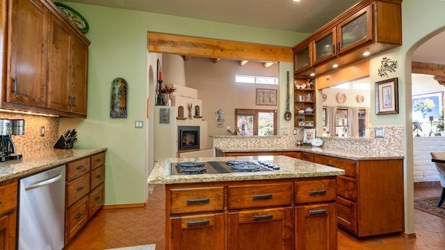 2 Chaco Ct, Sandia Park, NM 87047 - kitchen with stainless steel dishwasher, electric stovetop, brick floors, arched walkways, and backsplash