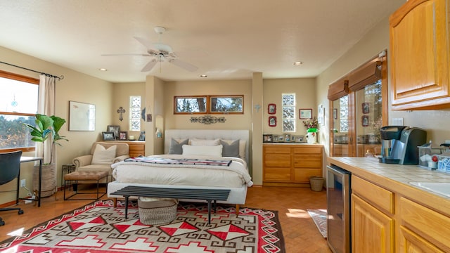 bedroom with wine cooler and ceiling fan