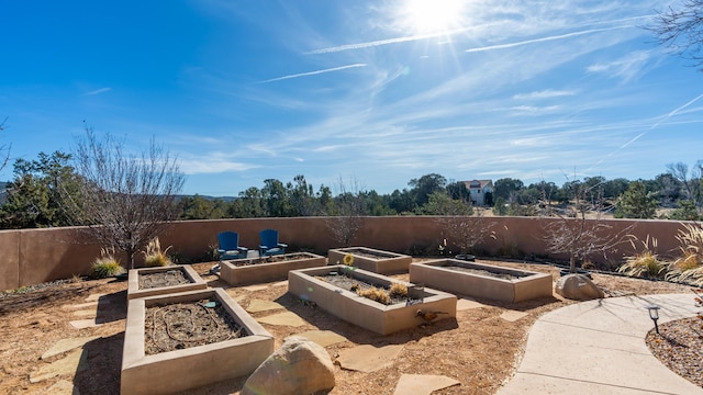 2 Chaco Ct, Sandia Park, NM 87047 - fenced backyard with a garden