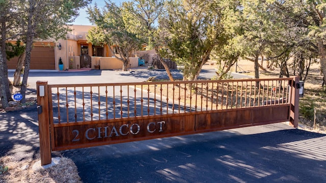 view of gate featuring a garage