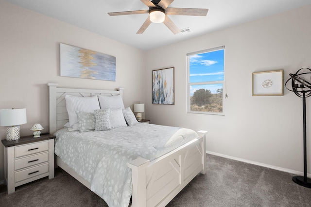 bedroom featuring ceiling fan, dark colored carpet, visible vents, and baseboards