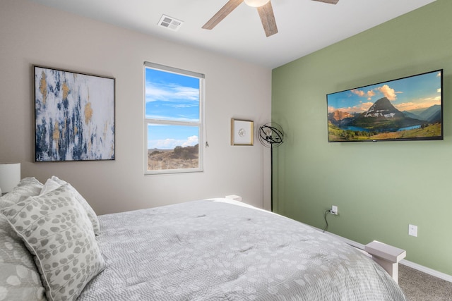 bedroom featuring baseboards, ceiling fan, visible vents, and carpet flooring