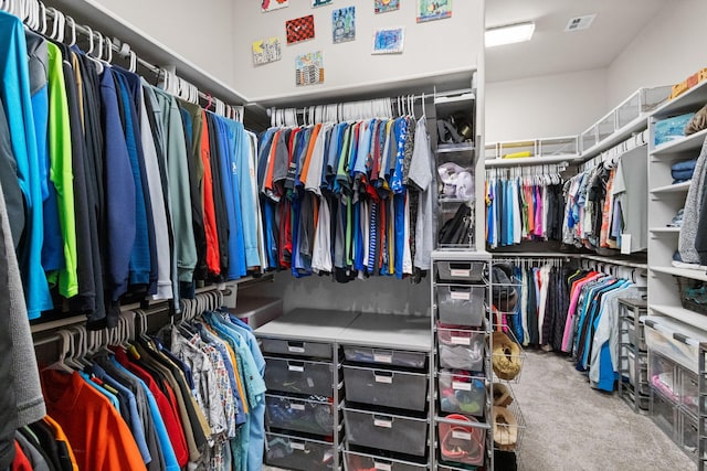 spacious closet with carpet floors and visible vents