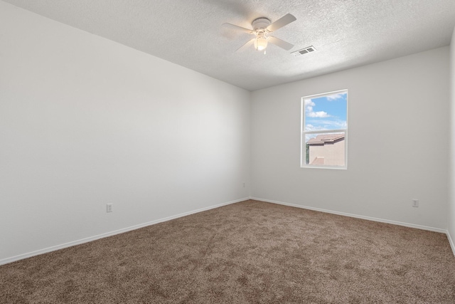 empty room with carpet, a textured ceiling, and ceiling fan