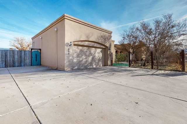 view of side of property with a garage