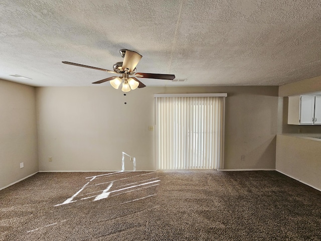 unfurnished room with ceiling fan and carpet floors