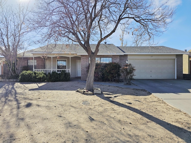 view of front of house featuring covered porch and a garage