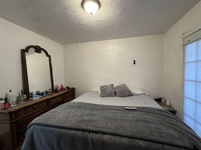 bedroom featuring a textured ceiling