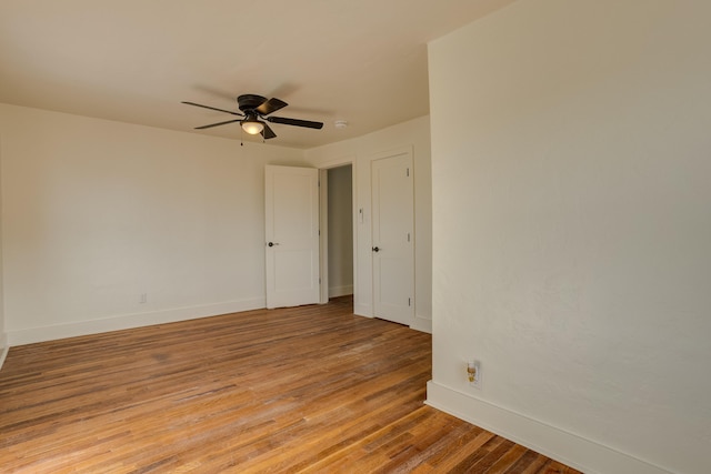 unfurnished room featuring light hardwood / wood-style flooring and ceiling fan