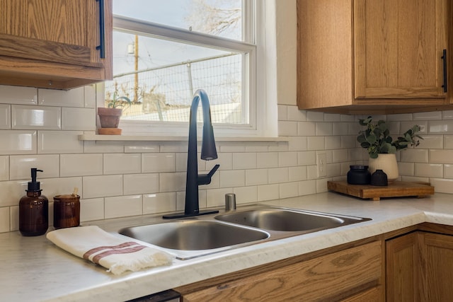 kitchen featuring sink and backsplash