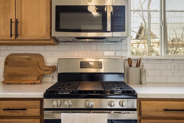 kitchen featuring backsplash and appliances with stainless steel finishes