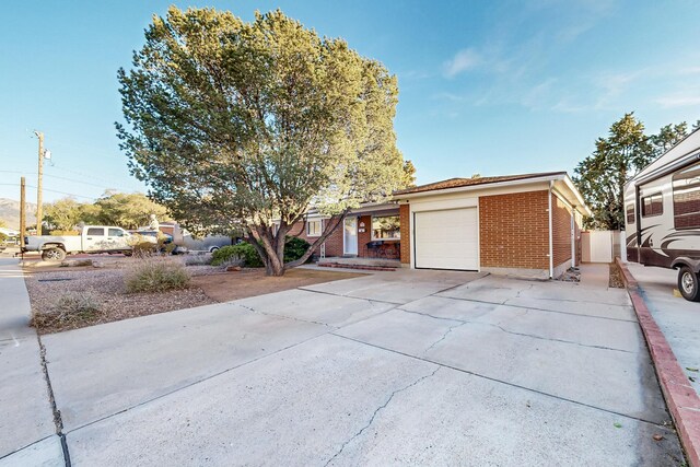 ranch-style home featuring a garage