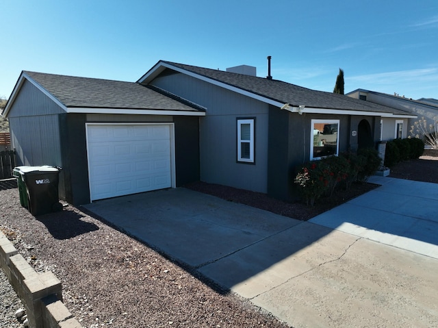 view of side of home with a garage