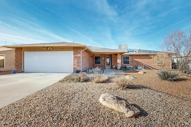 ranch-style house featuring a garage