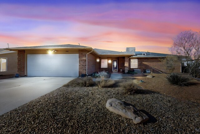 view of front of house featuring solar panels and a garage