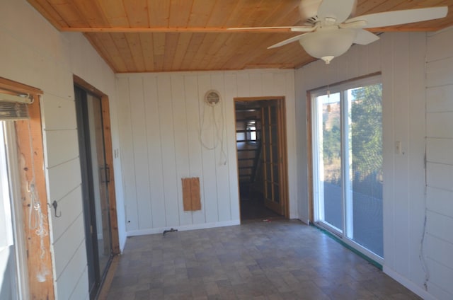 unfurnished sunroom with ceiling fan and wood ceiling