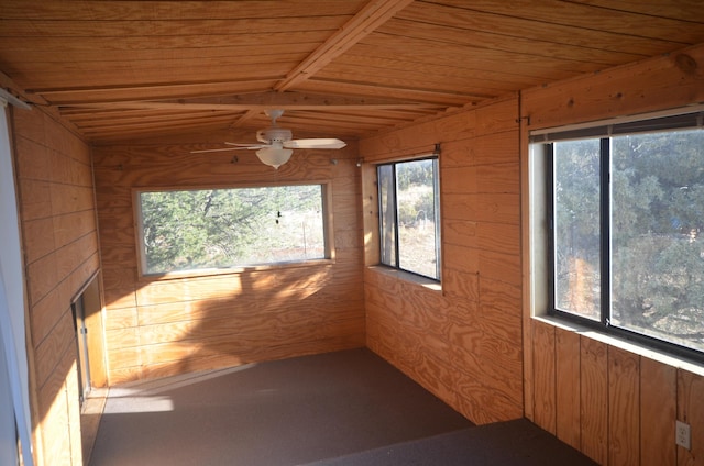 unfurnished sunroom with plenty of natural light, ceiling fan, and wood ceiling