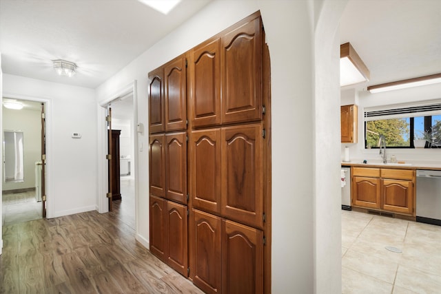 hall featuring sink and light hardwood / wood-style flooring