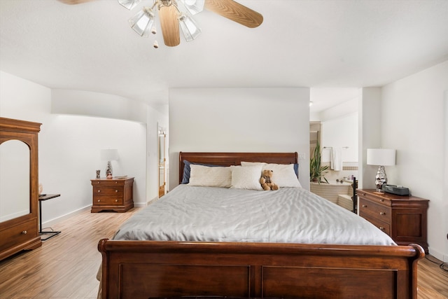 bedroom with ceiling fan and light hardwood / wood-style flooring