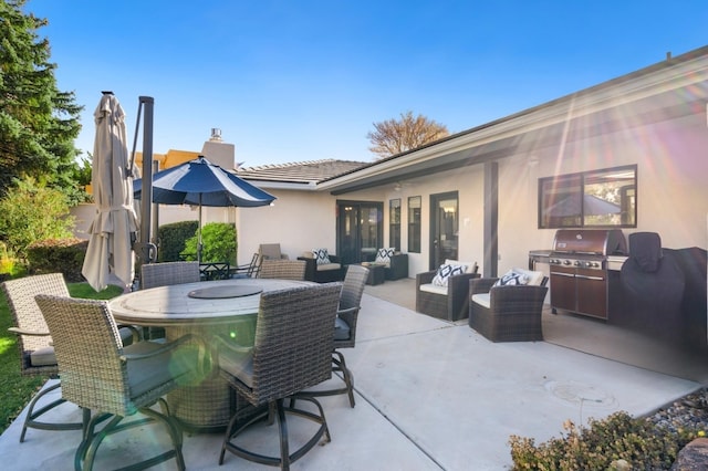 view of patio featuring area for grilling and an outdoor living space