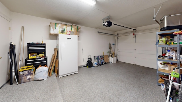 garage with white refrigerator and a garage door opener