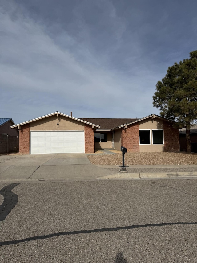 single story home featuring a garage