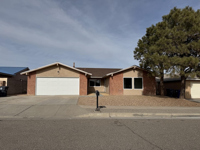 single story home featuring a garage