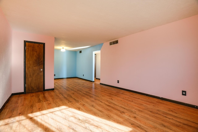 unfurnished room featuring light hardwood / wood-style floors