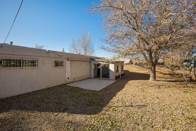 back of house with a patio area