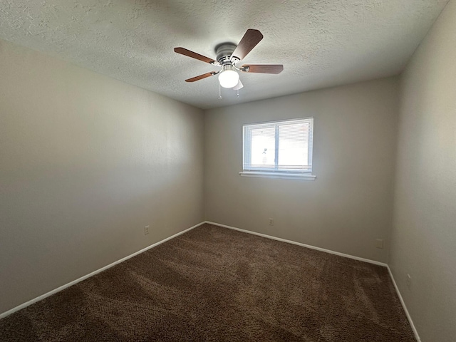 carpeted spare room featuring ceiling fan and a textured ceiling