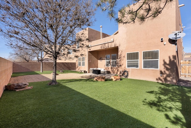 view of yard with a patio and a fenced backyard