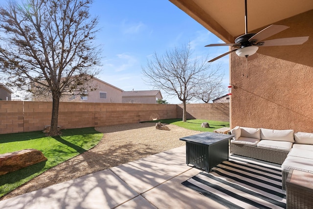 view of patio with a fenced backyard, a ceiling fan, and an outdoor living space