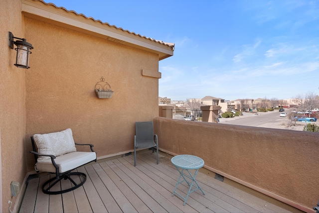 wooden terrace featuring a residential view